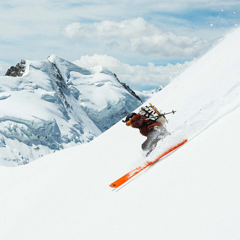 Skier riding down mountain with Agent 3 touring skis