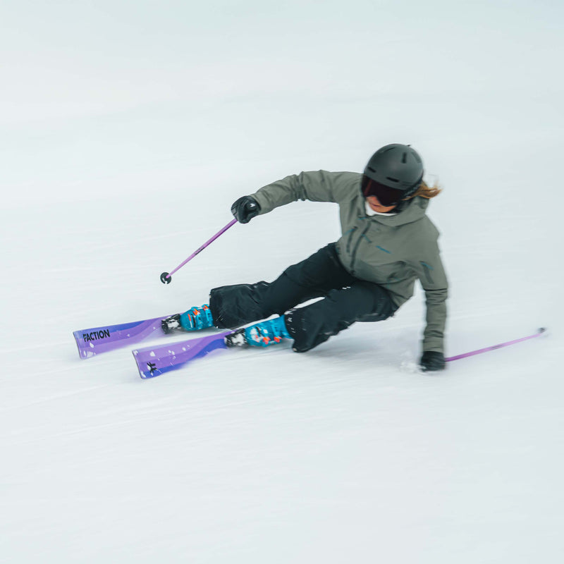 Girl skier carving on purple Dancer 2 all-mountain skis 2026