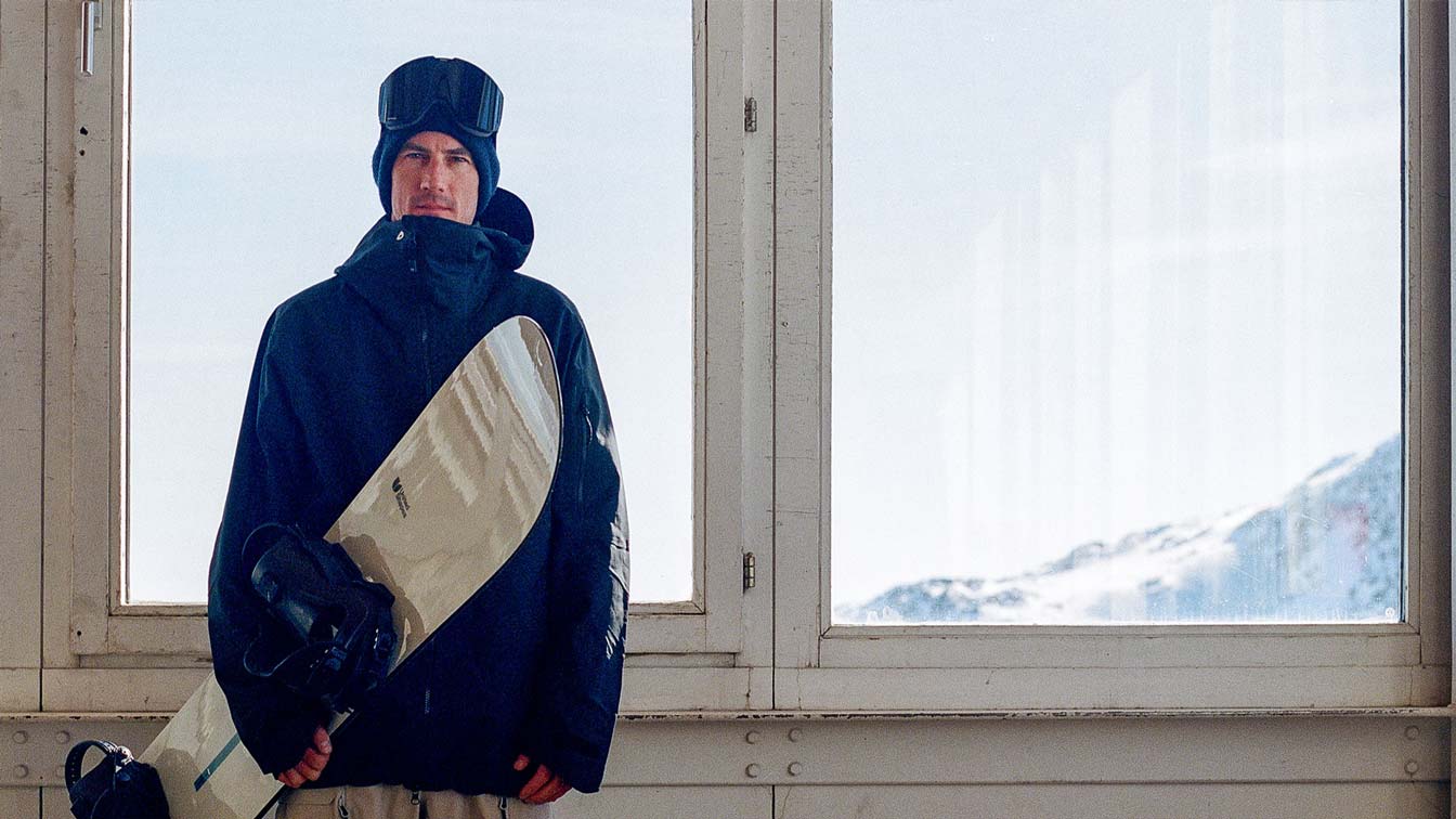 The man behind the lens is a… snowboarder?