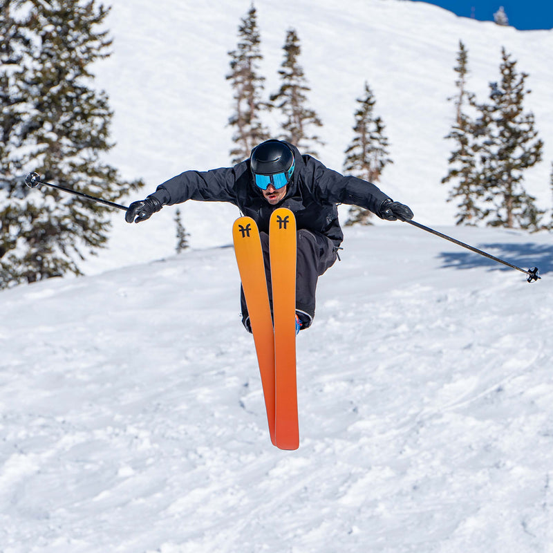 Freeride Skier jumping on orange Dancer 3 Freeride and all-mountain skis 2026
