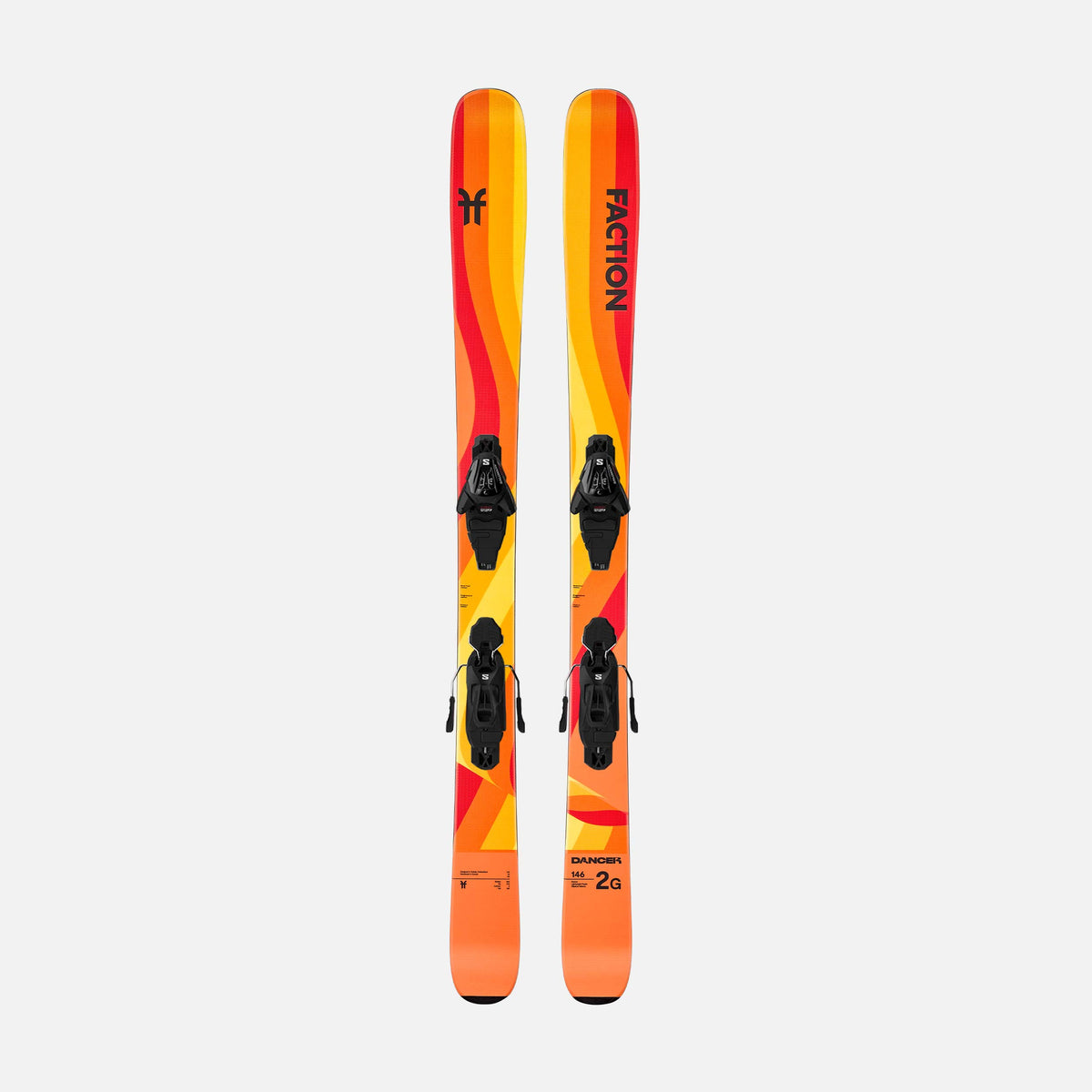 Orange and yellow Faction kids skis with L6 bindings on a white background