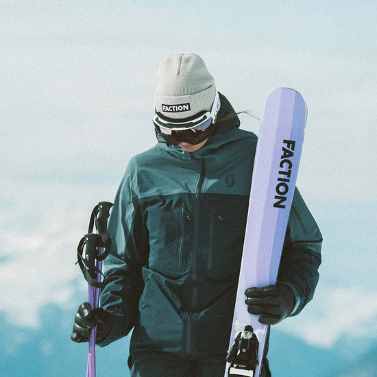 Skier wearing Faction skis logo beanie in grey