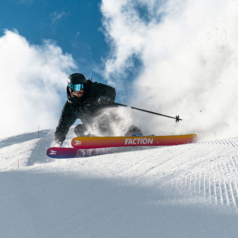 Skier jumping yellow and purple all-mountain and freeride Faction Studio 2 ski 2026