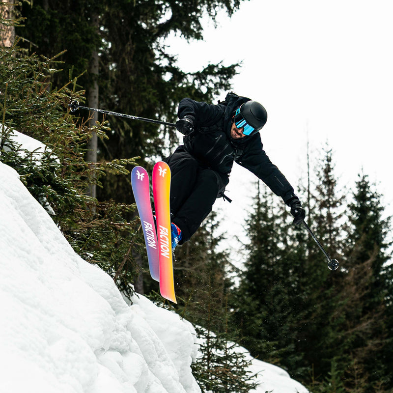 Skier carving yellow and purple all-mountain and freeride Faction Studio 2 ski 2026