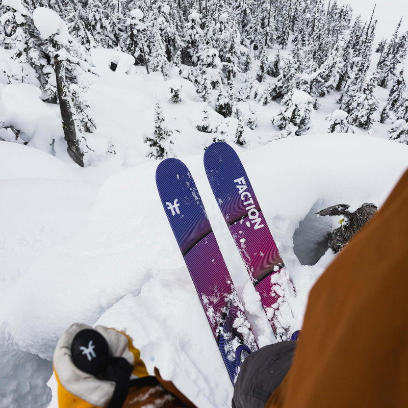 Freeride skier riding powder with yellow and purple powder and freeride Faction Studio 3 ski 2026