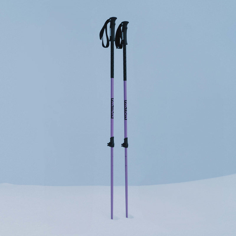 Purple Faction Skis Agent telescopic poles standing in the snow