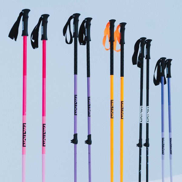 Set of Faction ski poles in various colors on a light blue background