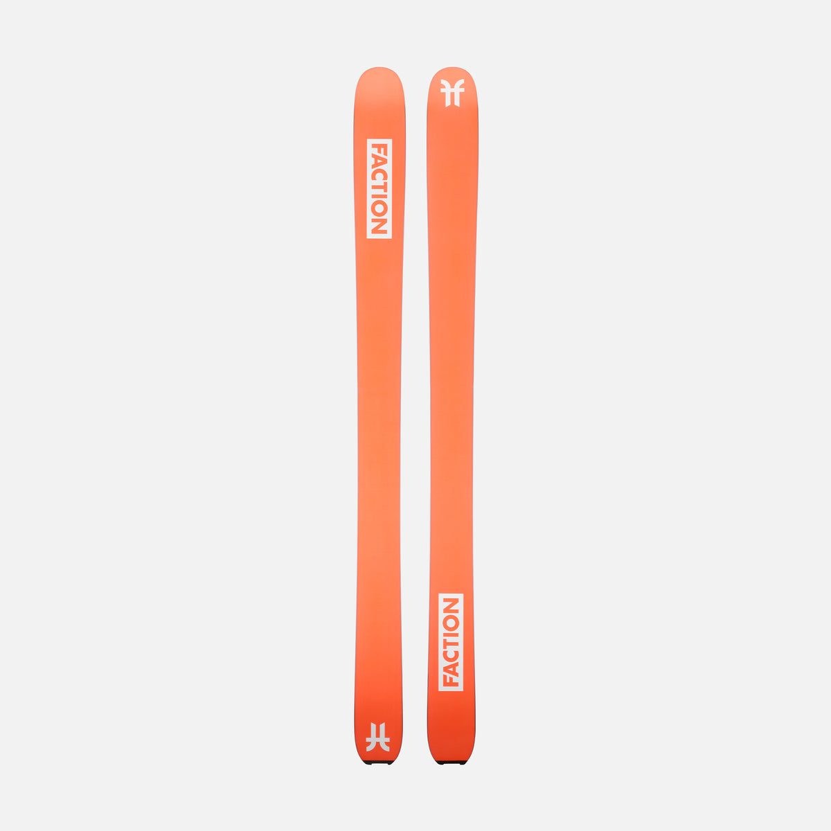 Two orange Faction skis on a light gray background