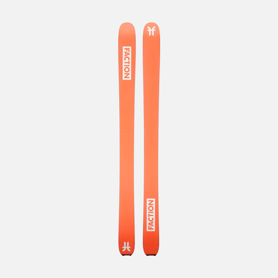 Two orange Faction skis on a light gray background