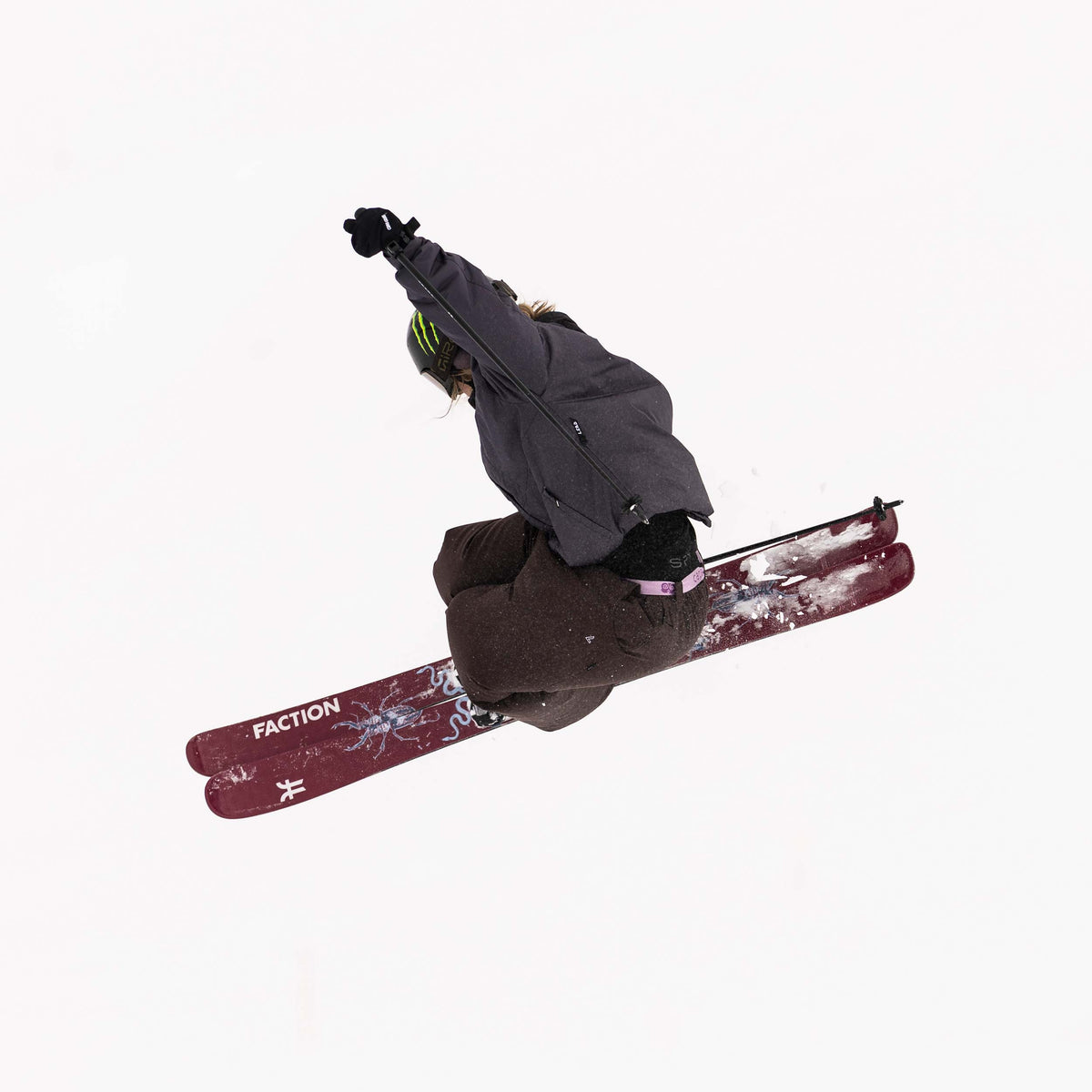 Skier in mid-air with Faction Prodigy 1 Capsule 2027 skis on a white background